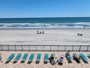 On the beach, sun loungers, beach towels