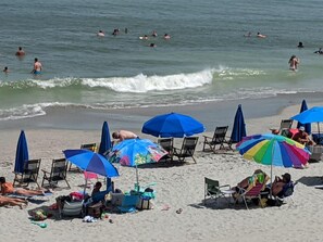 On the beach, sun loungers, beach towels