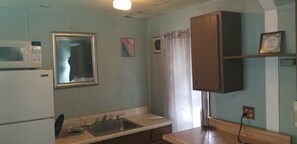 Fridge, microwave, stovetop, coffee/tea maker