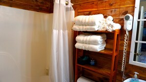 Combined shower/tub, hair dryer, towels, soap