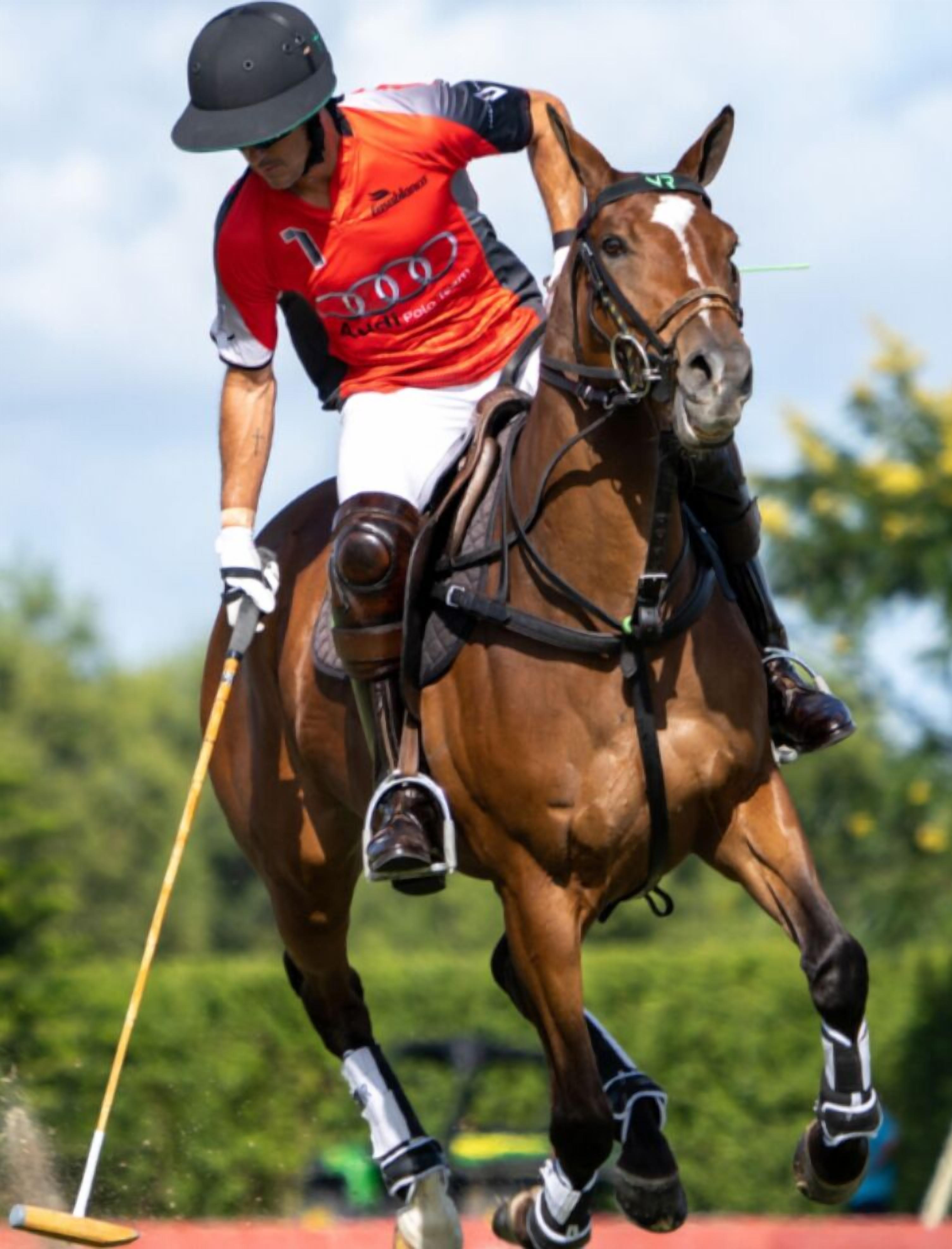 A jockey riding a horse in a competitive setting.