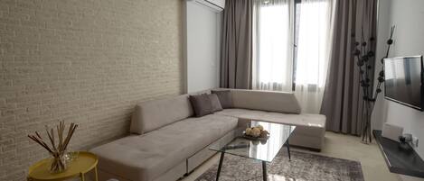 Deluxe Apartment | Living room | Flat-screen TV, Netflix, streaming services