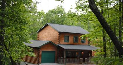 The West Virginian 3 storey log cabin in 10 acre wooded area adjacent to Pipestem State Park and Resort.