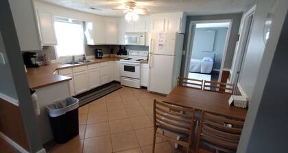 Neat,clean relaxed atmosphere located just outside of town .