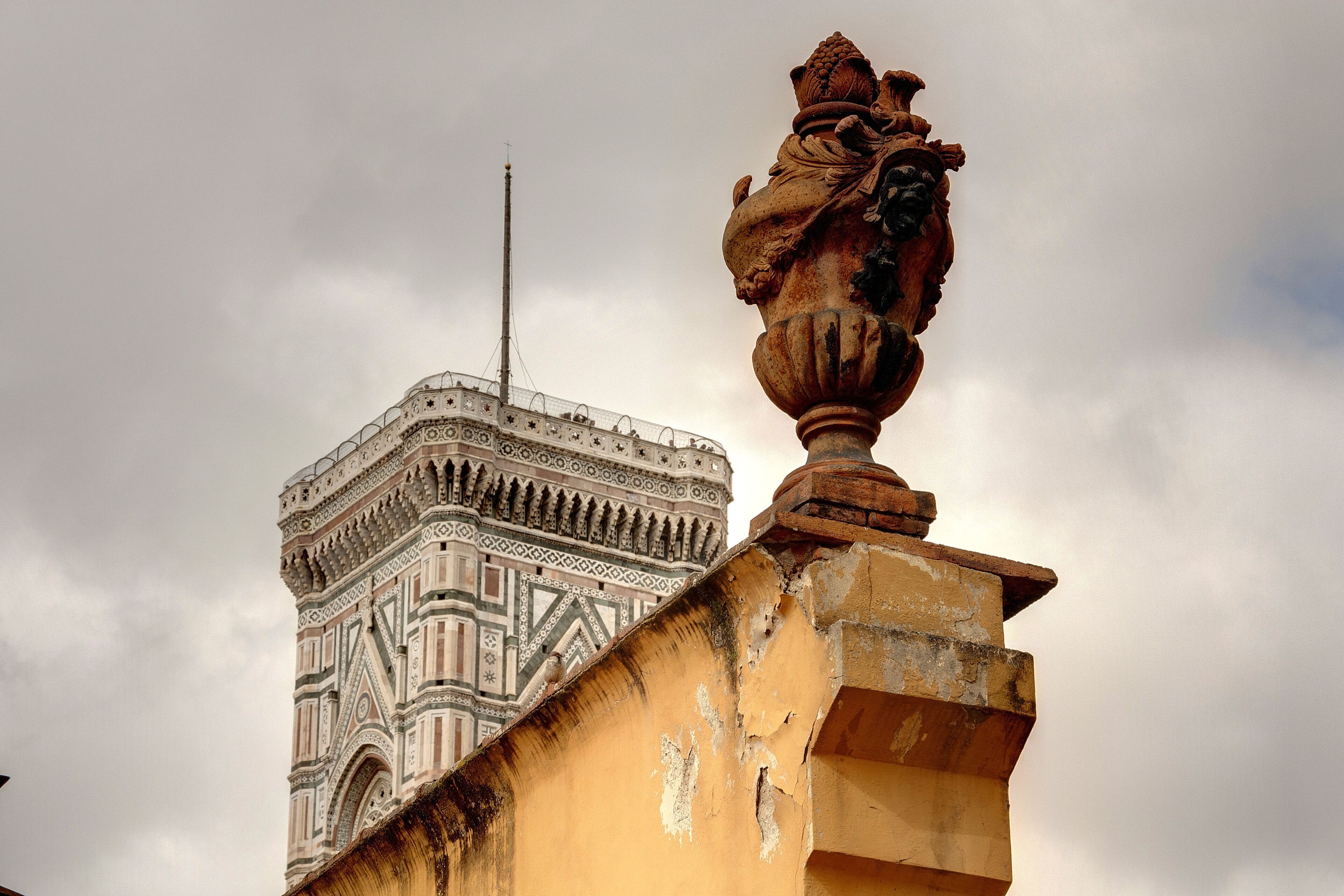 A building with a detailed facade and a prominent antenna.