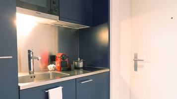 Microwave, coffee/tea maker, high chair, cookware/dishes/utensils