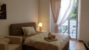 Premium bedding, desk, laptop workspace, iron/ironing board