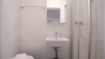 Shower, towels, soap, toilet paper