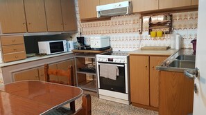 Apartment, 4 Bedrooms | Shared kitchen