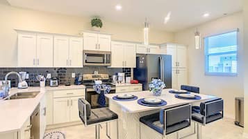 Coffee/tea maker, fridge, microwave, oven