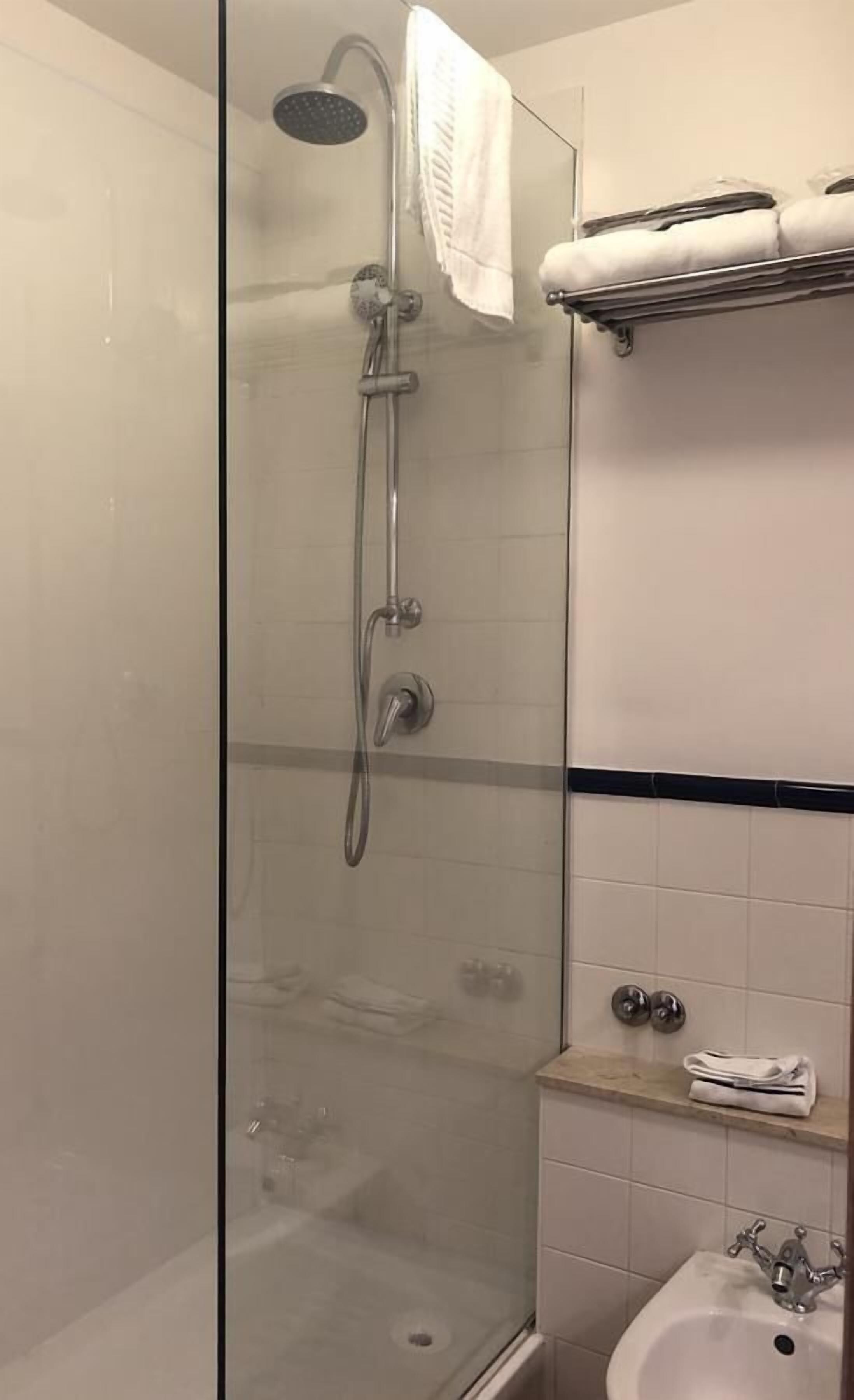 basic double room single use | bathroom | shower, free toiletries, hair dryer, slippers