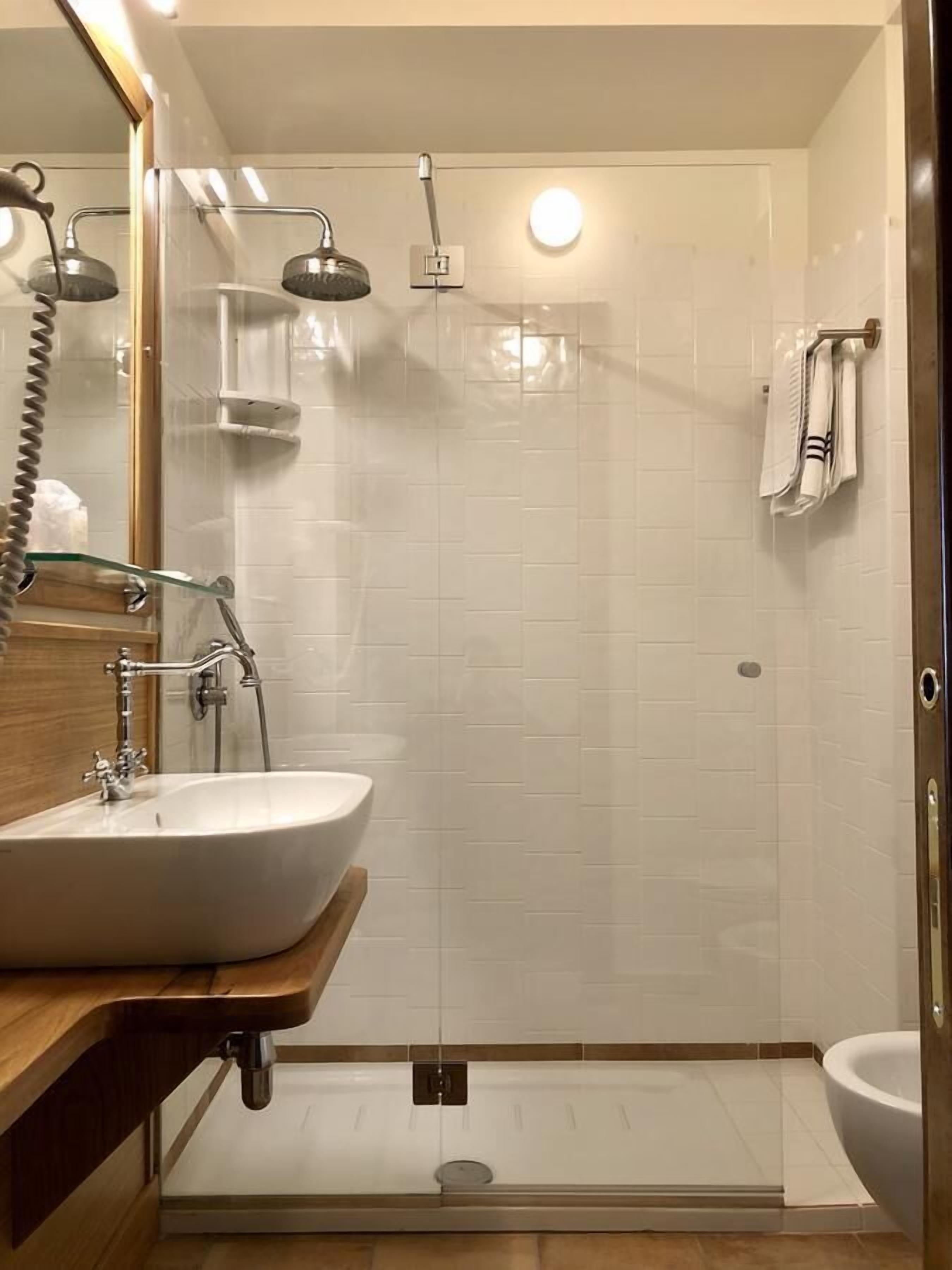 executive double room single use | bathroom | shower, free toiletries, hair dryer, slippers