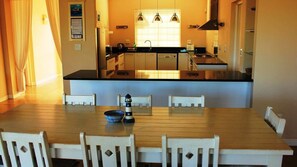 Enjoy cooking in this well-equipped kitchen with a central island and dining area.