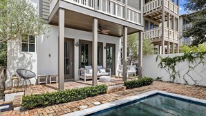 A modern house with a covered patio, a swimming pool, and a garden. - Private Pool | Walk to Rosemary Beach (Panama City Beach)