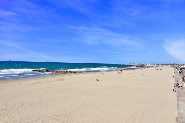 Enjoy a safe beach experience with a gentle shoreline and scenic promenade.