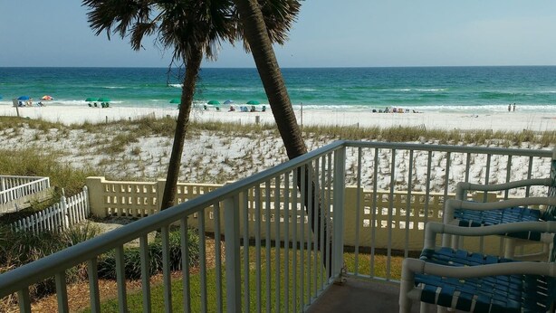 A balcony with a view of a beach and ocean. - Pet friendly on the beach with private balcony! (Fort Walton Beach)