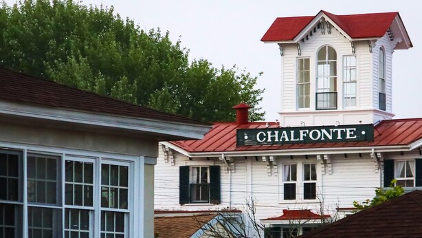 A building with a sign reading "CHALFONTE" and a red roof.