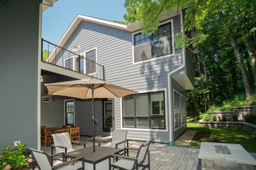 AMAZING NEWER HOME WITH LAKE VIEWS, steps away from shops and restaurants.