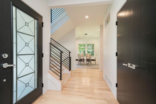 AMAZING NEWER HOME WITH LAKE VIEWS, steps away from shops and restaurants.