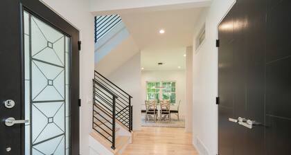 AMAZING NEWER HOME WITH LAKE VIEWS, steps away from shops and restaurants.