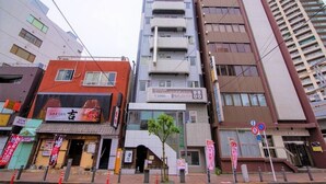 A multi-story building with a modern design, featuring a mix of commercial and residential spaces. - Vail sta. Takenotsuka (Tokyo)