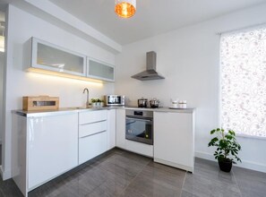 Apartment (2 Bedroom Apt w/ Balcony n Sea View-z) | Private kitchen | Fridge, highchair - Apartments Villa Capitano (Zupa dubrovacka)
