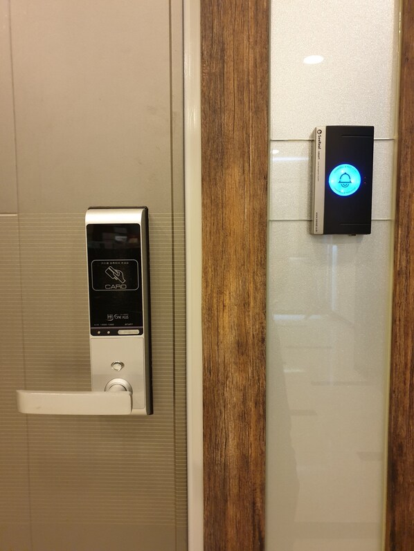 A card reader and a digital lock on a door.