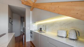 Signature Apartment | Private kitchen | Stovetop, dishwasher, coffee/tea maker, electric kettle