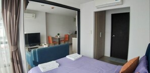 Suite, 1 Bedroom | 1 bedroom, desk, iron/ironing board, free WiFi - Sujinda Phuket Home Condo (Wichit)