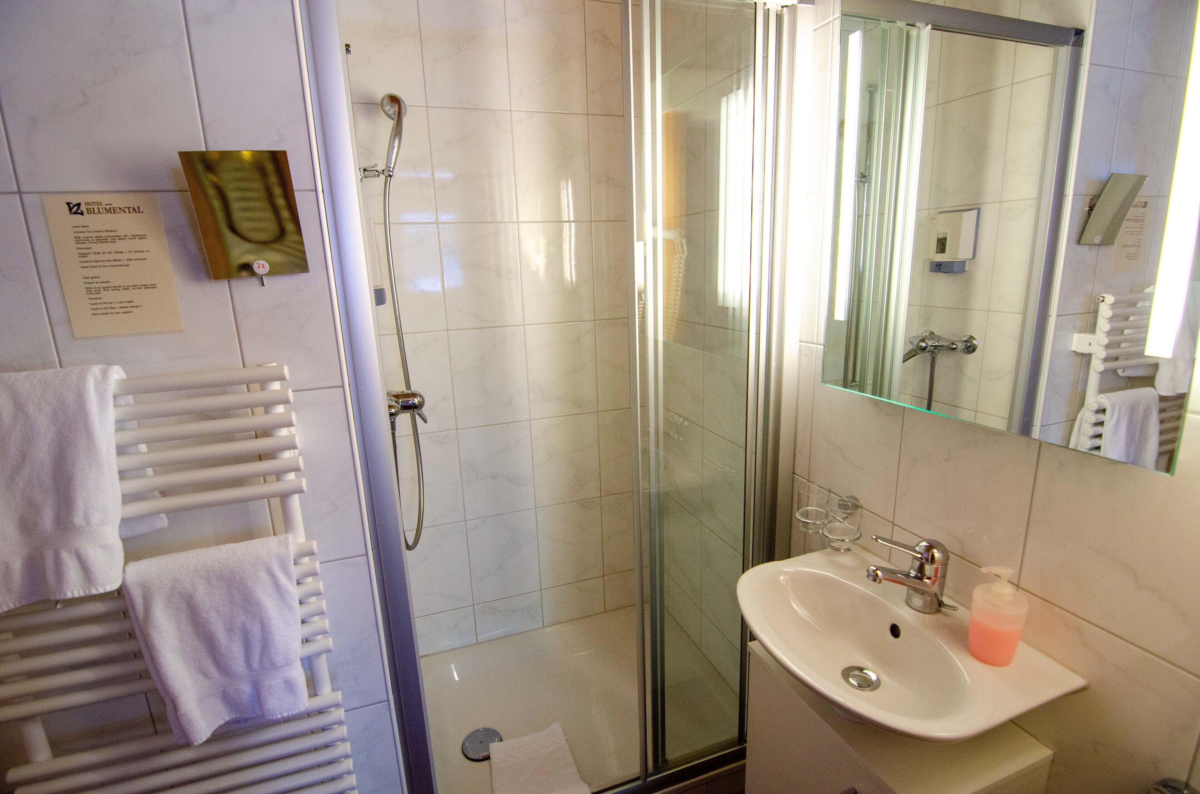 standard double room | bathroom | hair dryer, towels, soap, shampoo