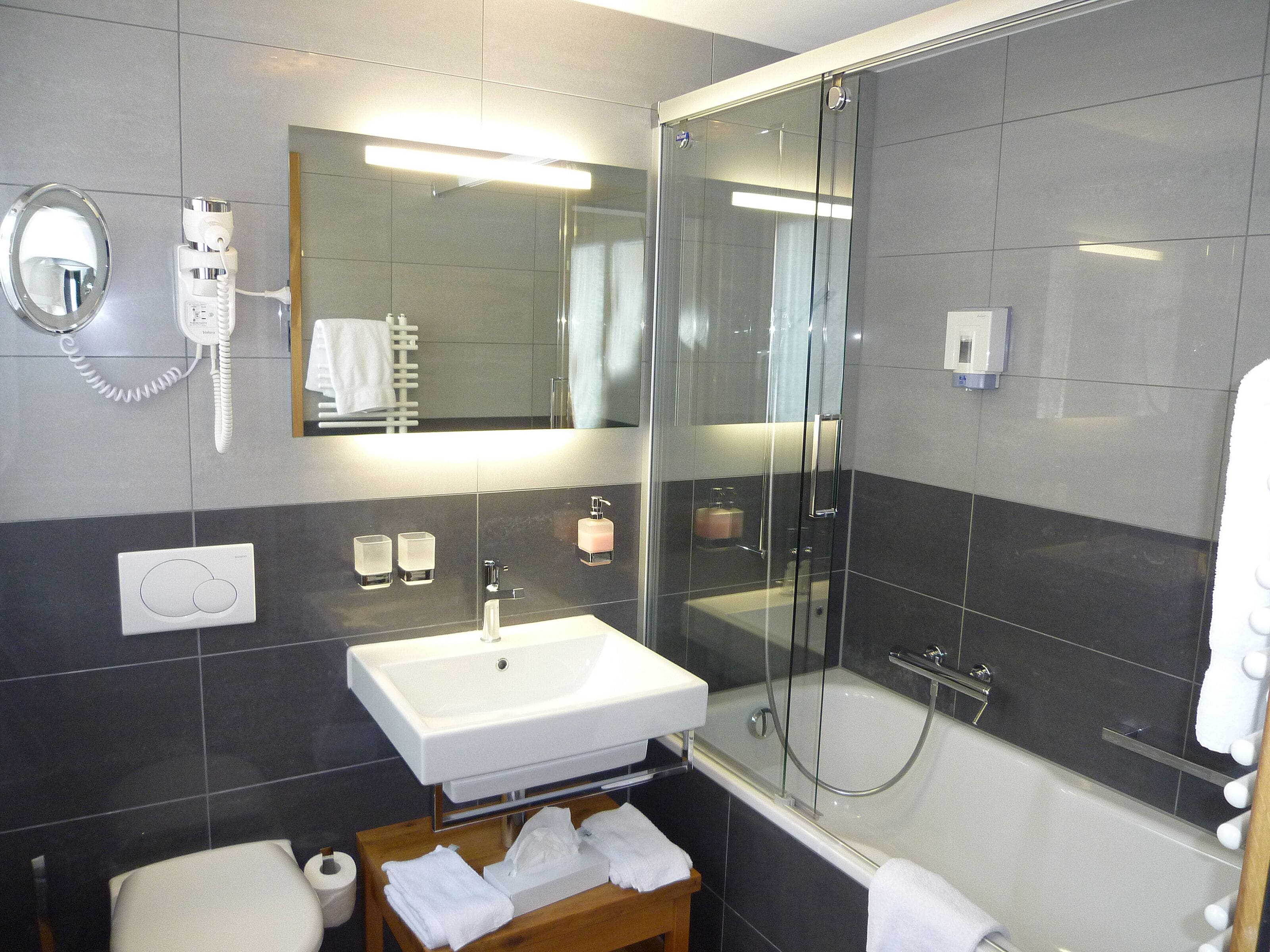 superior double room | bathroom | hair dryer, towels, soap, shampoo