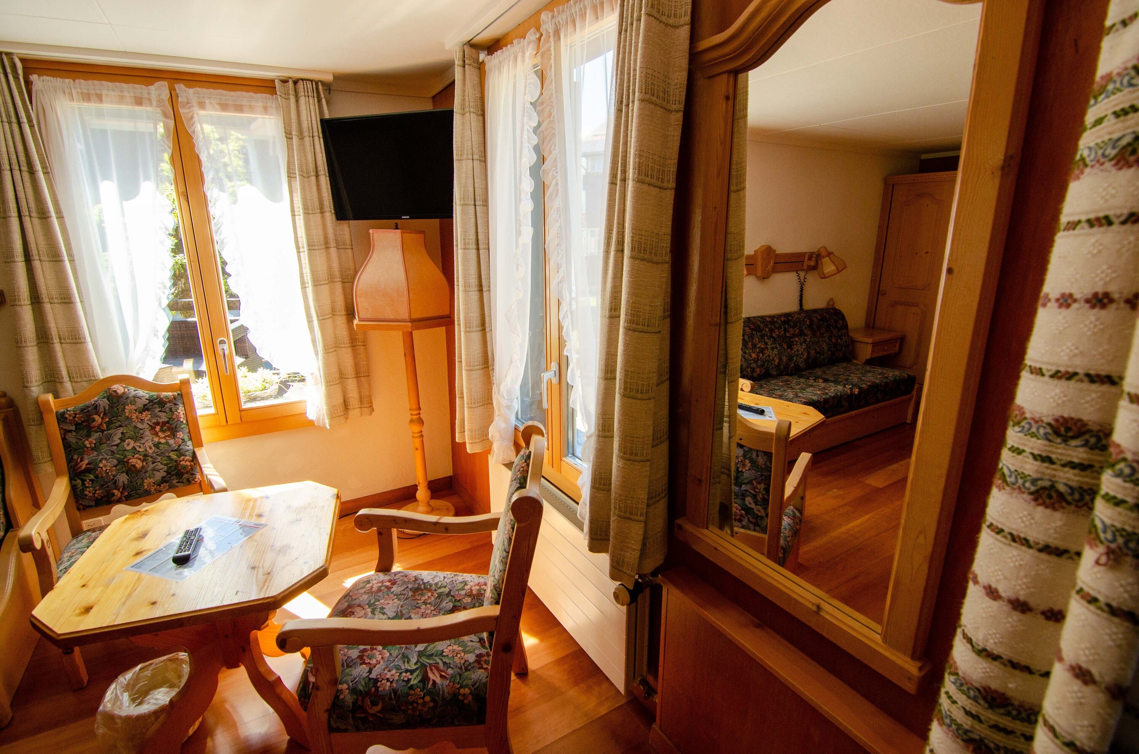 family double room | living area | flat-screen tv