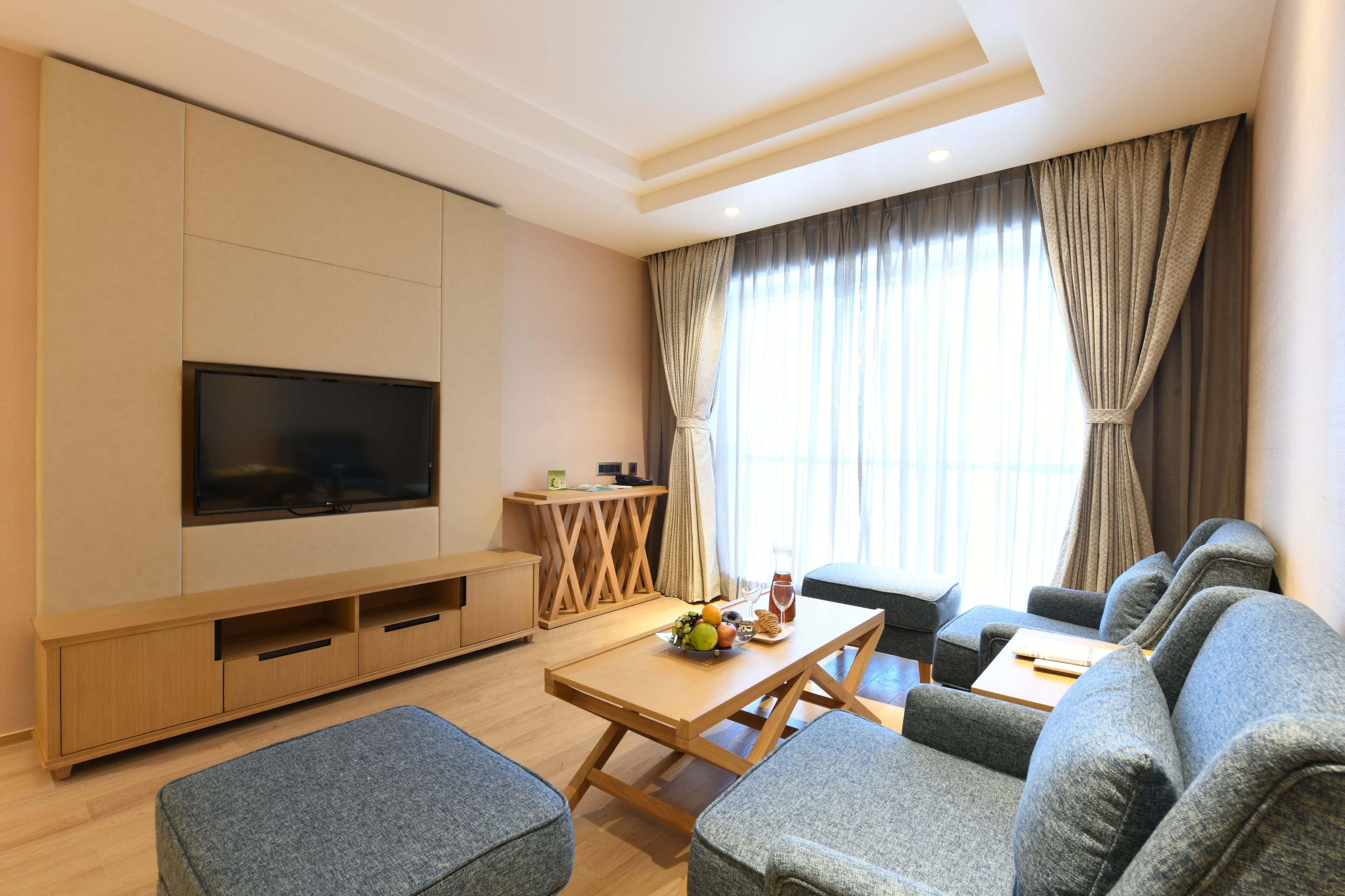 Hazel Suite | Living area | 52-inch TV with satellite channels