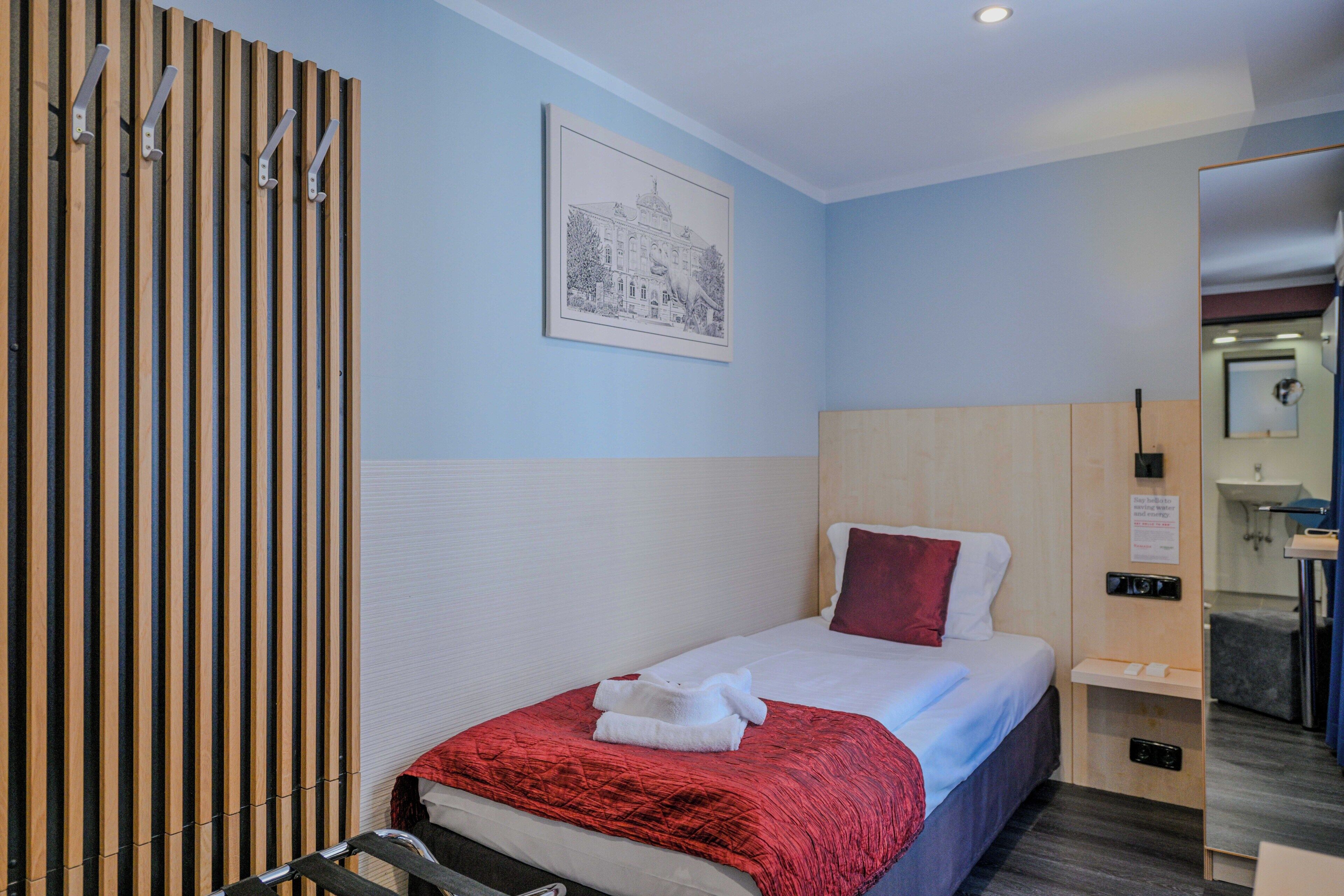 经济单人房 | 迷你吧、客房内保险箱、遮光窗帘、隔音