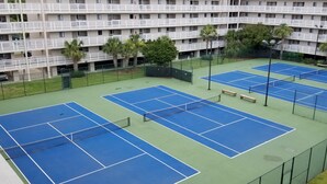 A multi-level hotel with a tennis court complex. - Newly Renovated Hilton Head Resort Beach Condo - 2 Bedroom - Private Balcony (Hilton Head Island)