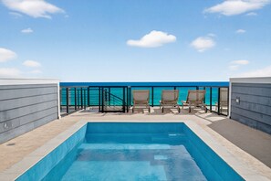 A rooftop pool, a heated pool