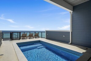 A rooftop pool, a heated pool