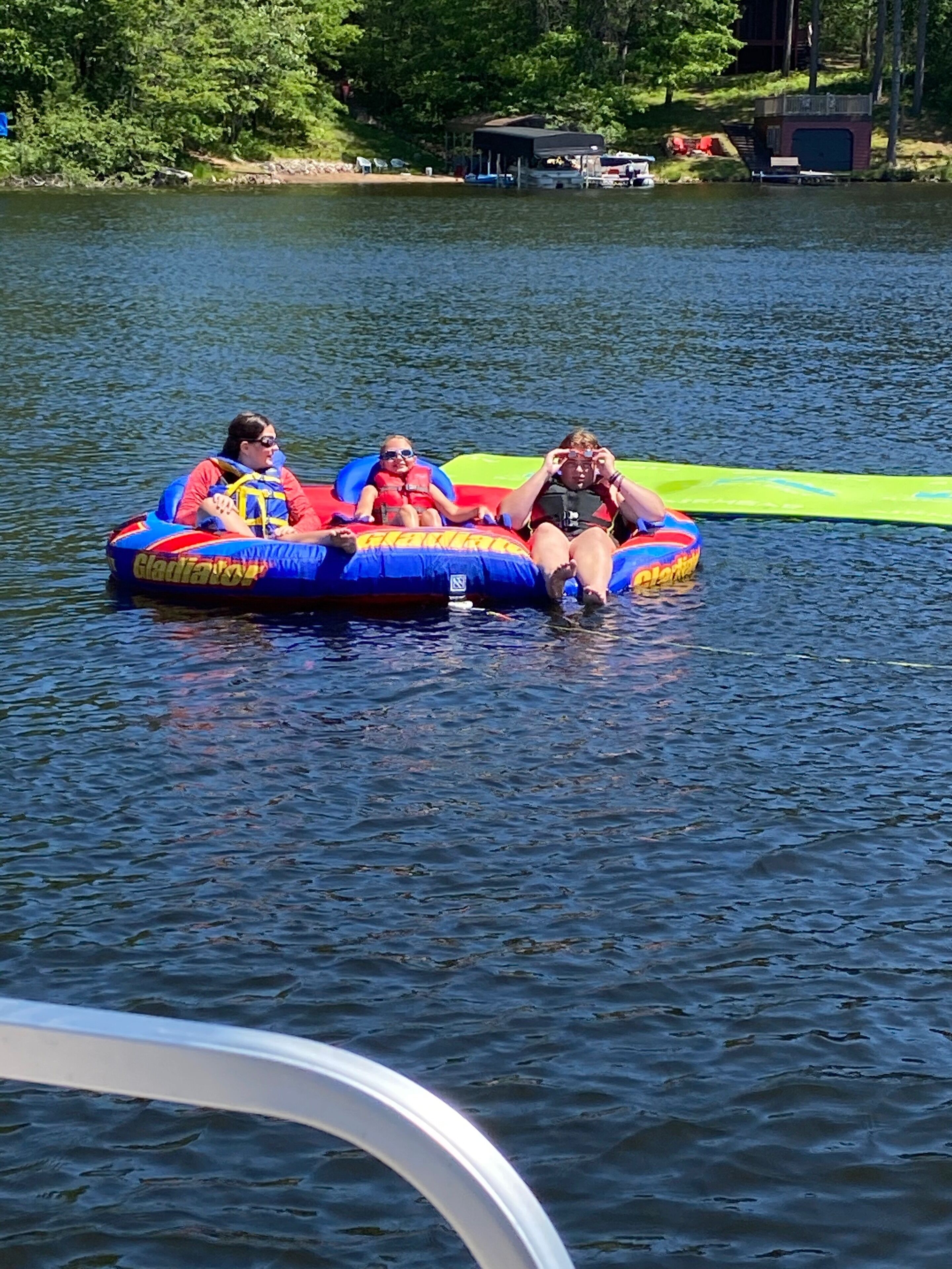 A lake with inflatable rafts.