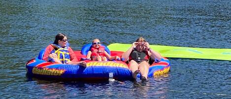 A lake with inflatable rafts.