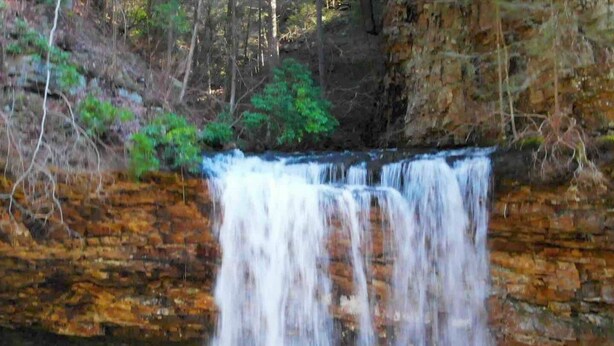 A waterfall cascading over a rocky cliff.