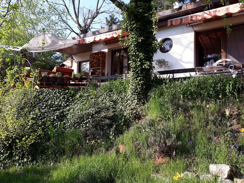 Bungalow on the outskirts with terrace under mature trees
