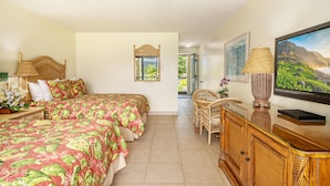 A hotel room with two beds, a television, a dining area, and a view of the outdoors. - HBR Family Lockoff 1206, Mountain View, Close to the Pool  Add'l Resort Fees (Princeville)
