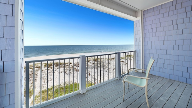 A covered porch with a view of the beach and ocean. - Sea Monster, East. Pool. Extra fridges. Lots of space. And right on the beach! (Gulf Shores)