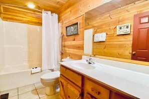 Combined shower/tub, hair dryer, towels, soap - The Woodshed Cabin #304 (Mountain View)