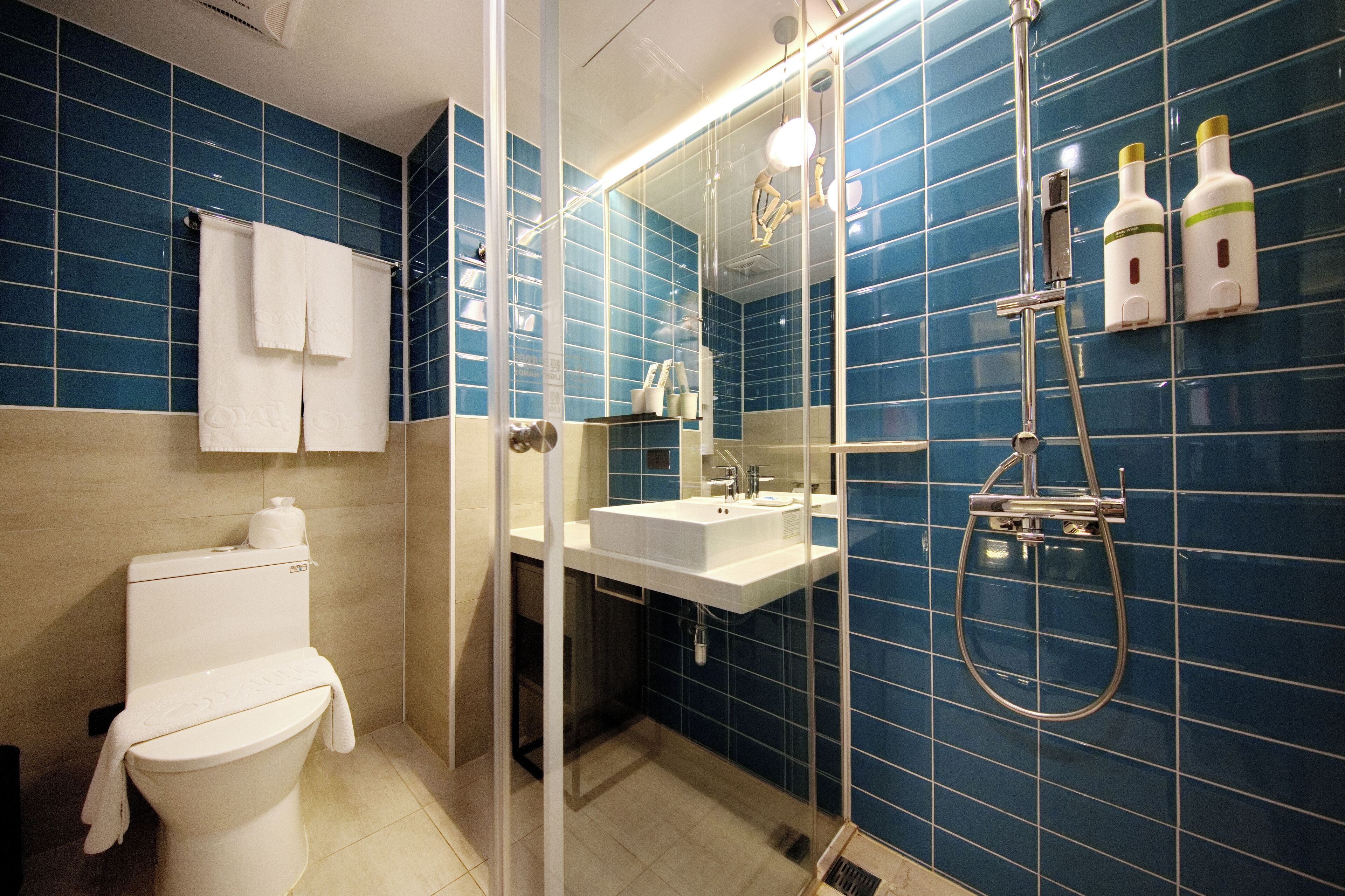 superior double room | bathroom | shower, hair dryer, towels, shampoo