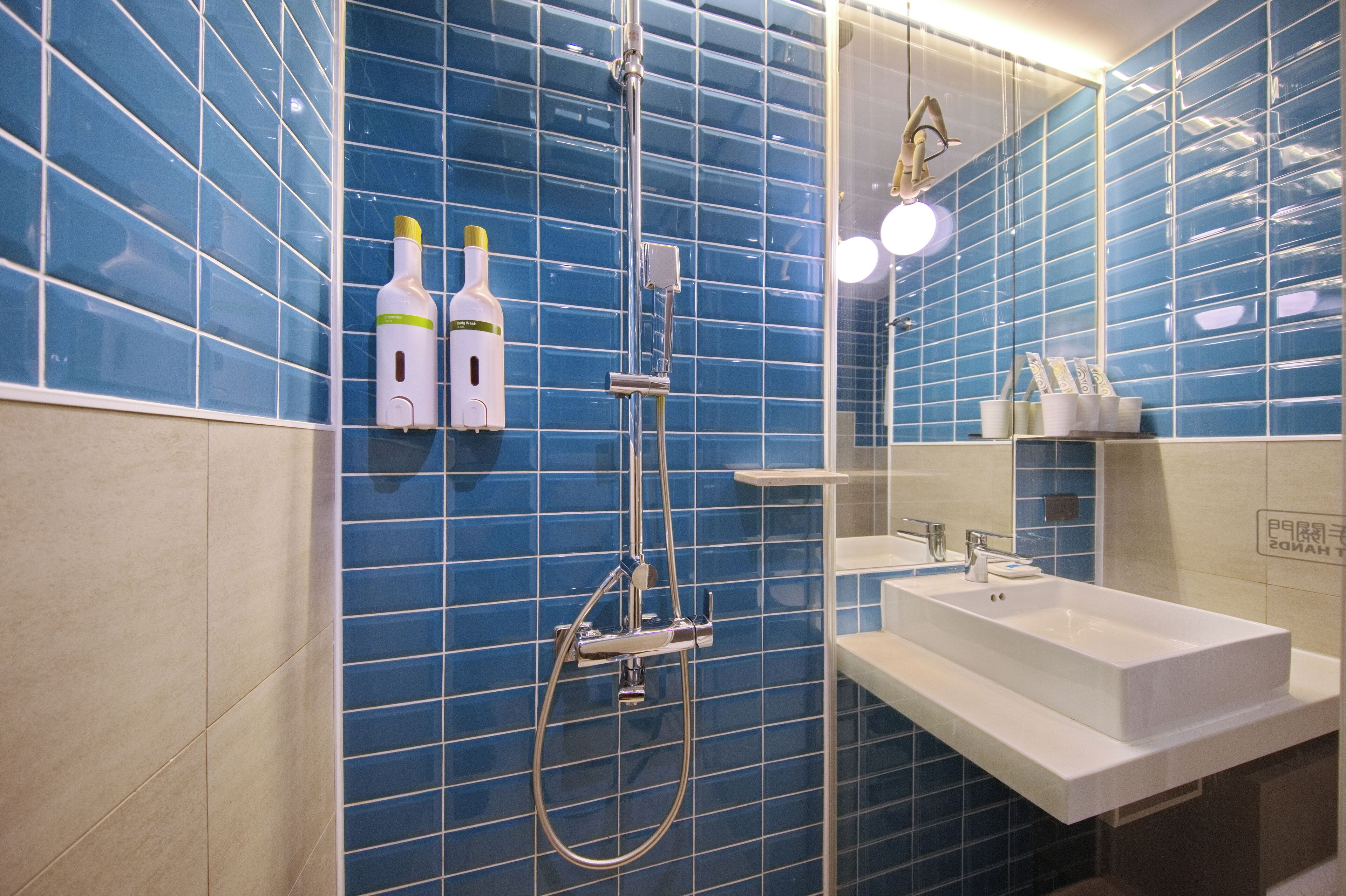 quadruple room | bathroom | shower, hair dryer, towels, shampoo