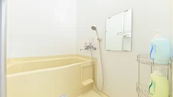 Separate bathtub and shower, free toiletries, hair dryer, slippers