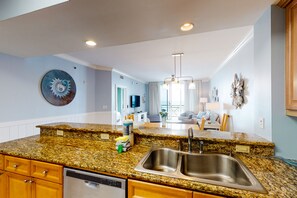 Enjoy cooking in this well-equipped kitchen with a dishwasher and double sink.