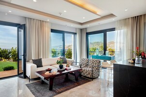 2+1 Sea View, Deluxe Villa | Living area | 170-cm LCD TV with satellite channels, TV, fireplace