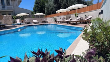 Seasonal outdoor pool, pool umbrellas, sun loungers